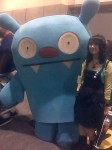 Ugly Doll hugging a woman