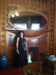 Aviva with a large wooden fireplace