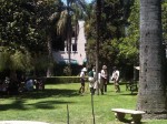 People in period dress playing croquet