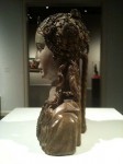 Side view of the wooden woman bust Side view of the wooden woman bust