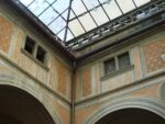 On the right is a fake window with a woman looking out