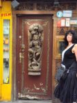 Aviva in front of an Indian restaurant