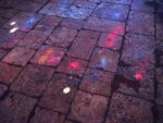 Some of the colored sunlight on the stone floor