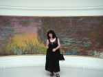 Aviva in front of a Monet painting of the lilies