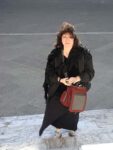 Aviva in the wind on the steps of the Duomo