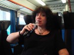 Aviva having a Coke Light on the train to Siena