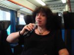 Aviva having a Coke Light on the train to Siena