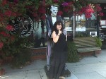 Aviva with the monster (statue) in front of Dark Delicacies