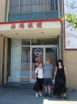 Lil, Brian and Aviva in front of a building in Chinatown