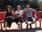 Aviva, Lil and Brian on a park bench in Chinatown