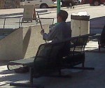 A guy playing a pipa in Chinatown