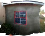 The end of the studio with the first coat of stucco applied