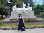 Aviva in front of a statue