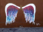 Wings painted on the side of a building