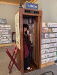 Aviva in an old phone booth